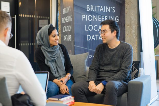 2 people talking in the Geovation Hub