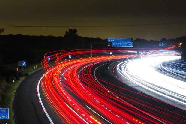 Car taillights on a motorway at night