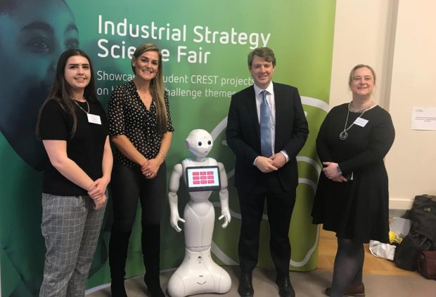 Chris Skidmore and students with Pepper the robot